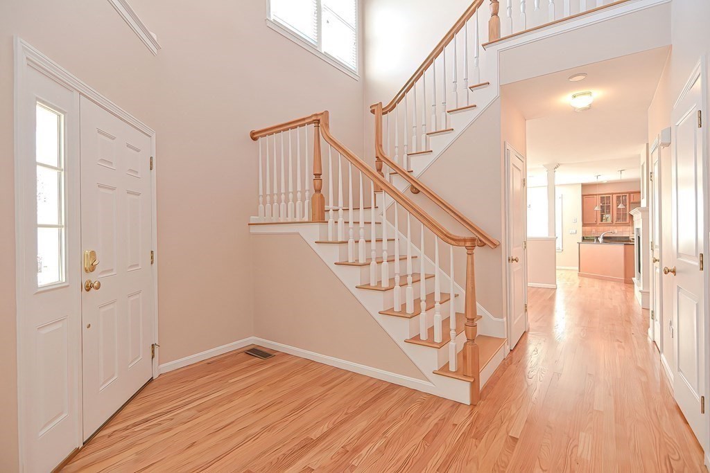 30 Codding Road, Unit 30 Norton, MA 02766 - Photo 17 of 40 a view of entryway with wooden floor and stairs