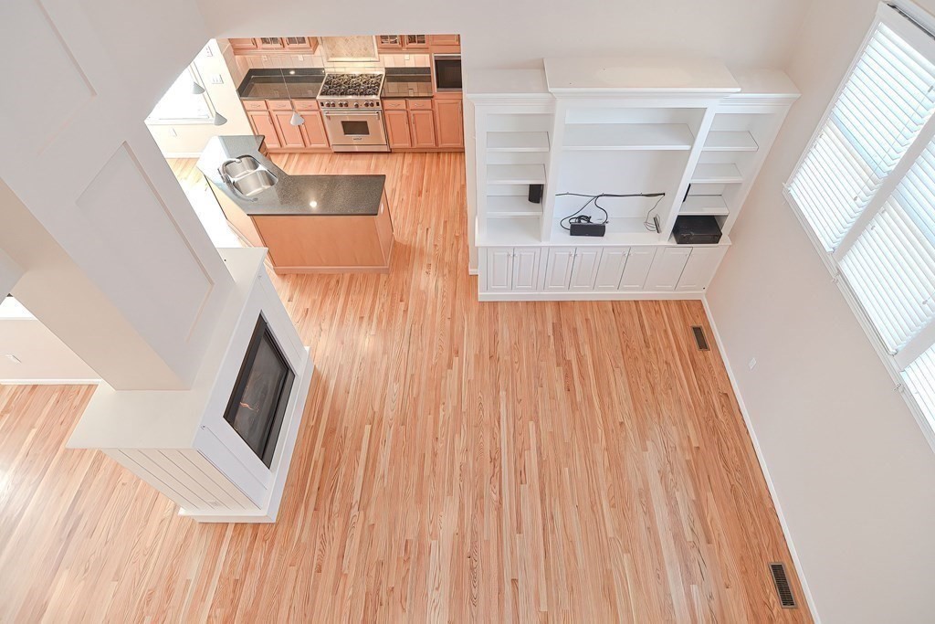 30 Codding Road, Unit 30 Norton, MA 02766 - Photo 26 of 40 a view of a living room with furniture and wooden floor