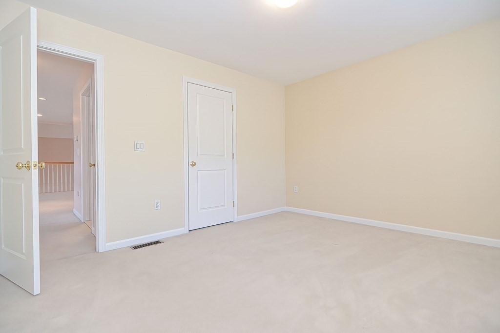 30 Codding Road, Unit 30 Norton, MA 02766 - Photo 29 of 40 an empty room with an entryway