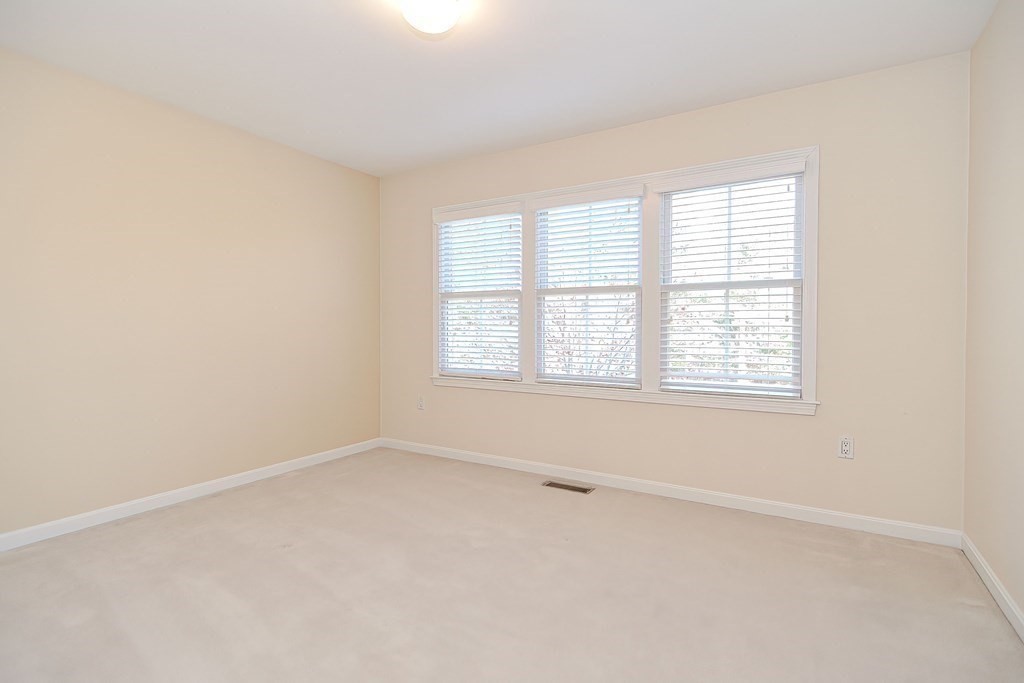 30 Codding Road, Unit 30 Norton, MA 02766 - Photo 30 of 40 an empty room with a window