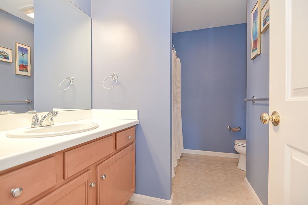 30 Codding Road, Unit 30 Norton, MA 02766 - Photo 31 of 40 a bathroom with a sink and a mirror