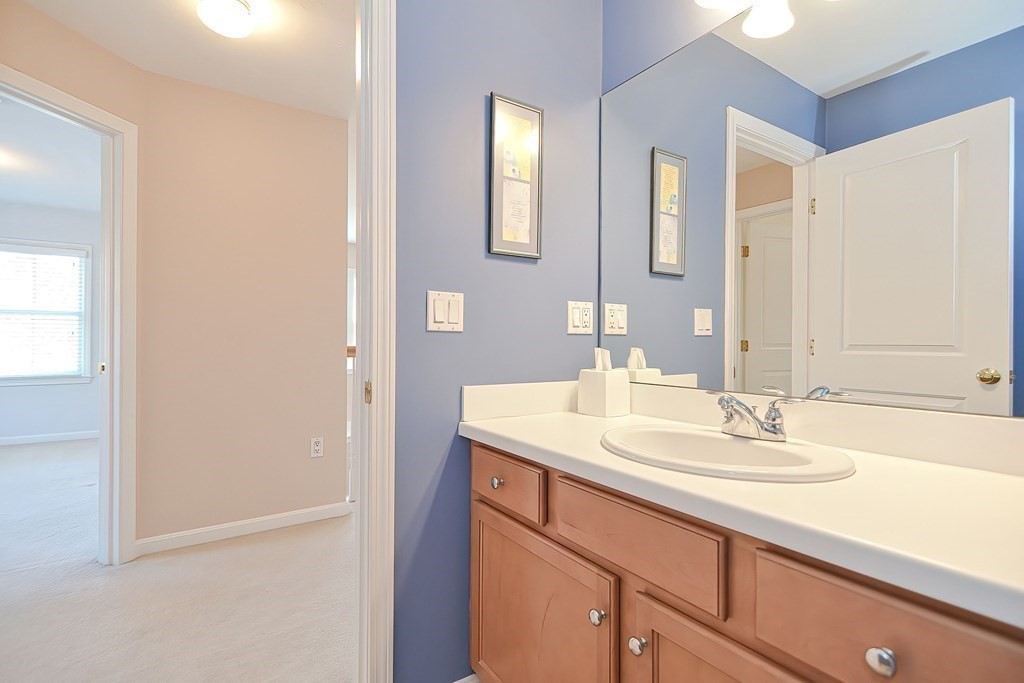 30 Codding Road, Unit 30 Norton, MA 02766 - Photo 32 of 40 a bathroom with a sink and a mirror
