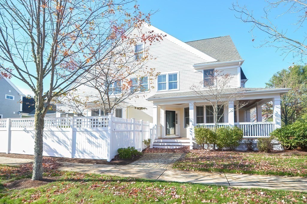 30 Codding Road, Unit 30 Norton, MA 02766 - Photo 35 of 40 a view of a white house next to a yard with big trees