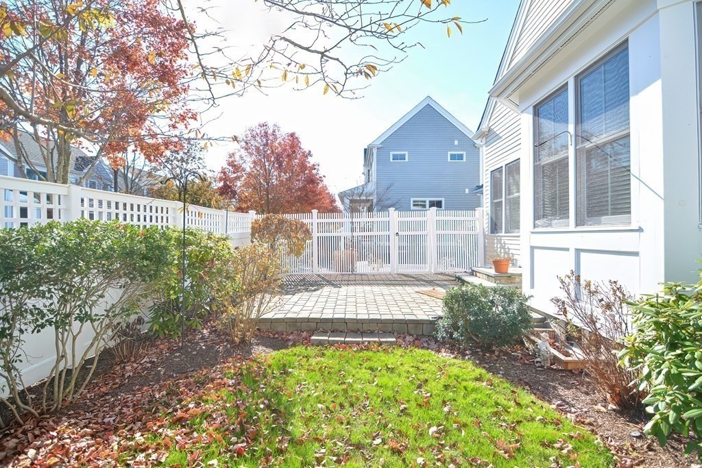 30 Codding Road, Unit 30 Norton, MA 02766 - Photo 36 of 40 a view of a house with a small yard and large trees