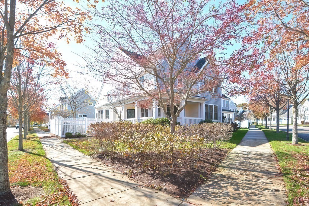 30 Codding Road, Unit 30 Norton, MA 02766 - Photo 39 of 40 a tree in front of a brick house with a large tree