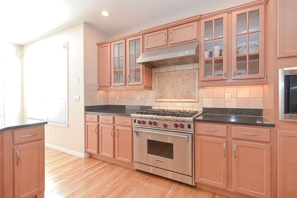 30 Codding Road, Unit 30 Norton, MA 02766 - Photo 6 of 40 a kitchen with granite countertop a stove and a sink