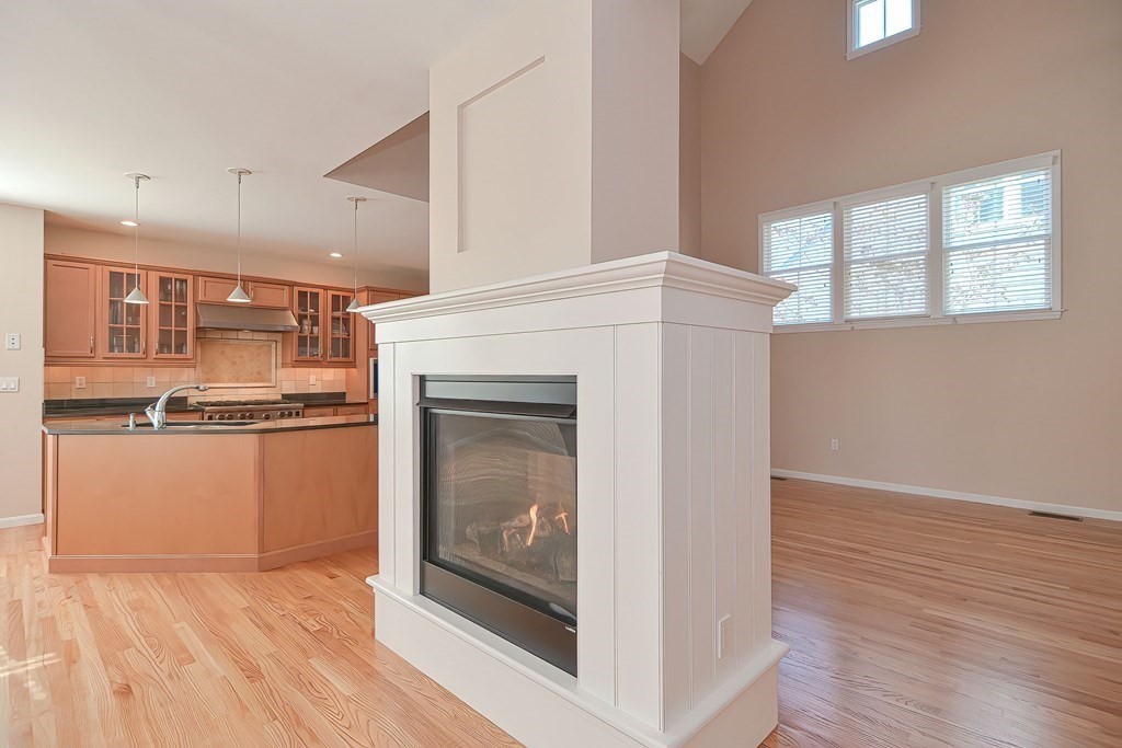 30 Codding Road, Unit 30 Norton, MA 02766 - Photo 10 of 40 a kitchen with stainless steel appliances granite countertop a stove a microwave and a refrigerator