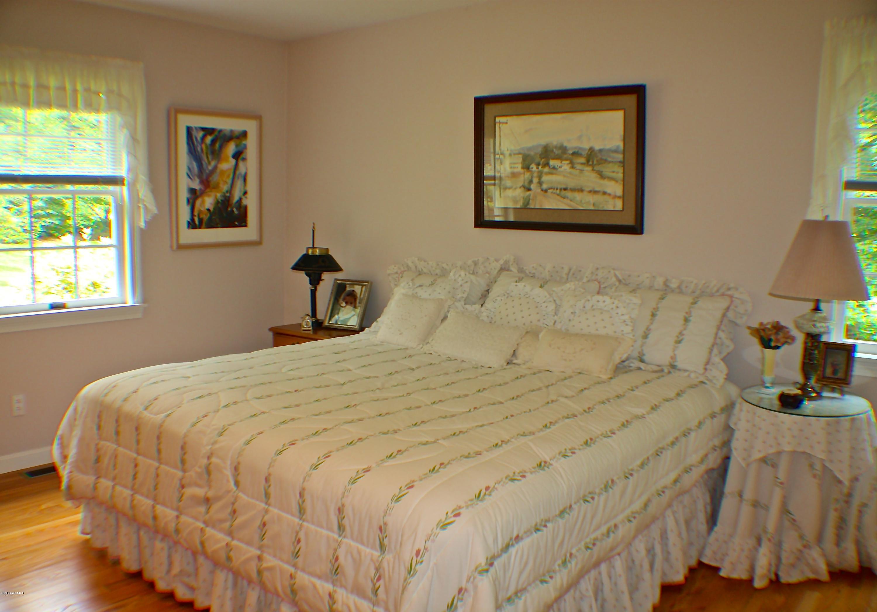 11 Quiet Knoll Road Stockbridge, MA 01266 - Photo 16 of 23 a bedroom with a bed and a painting on the wall