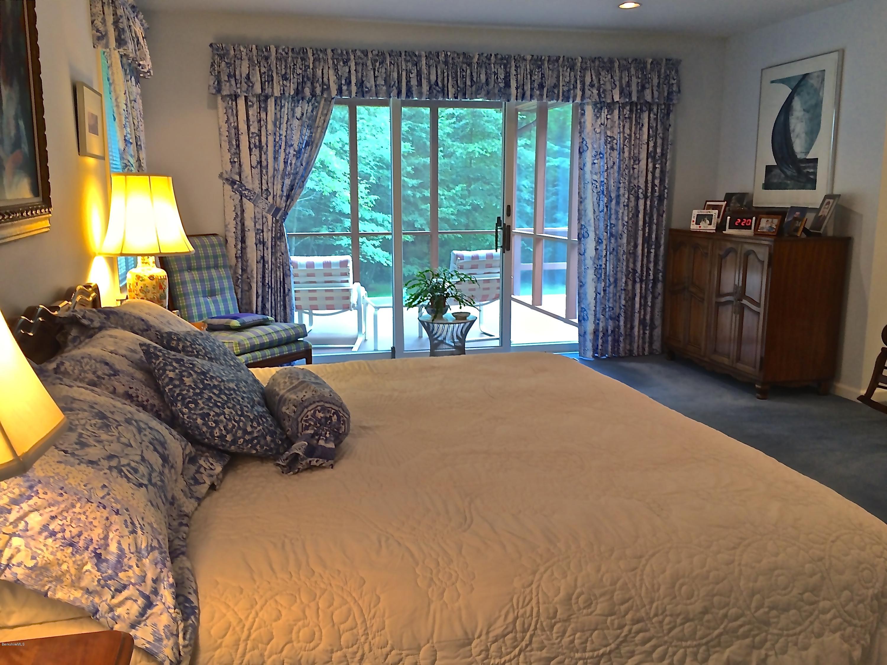 11 Quiet Knoll Road Stockbridge, MA 01266 - Photo 17 of 23 a bedroom with a bed dresser and a large window