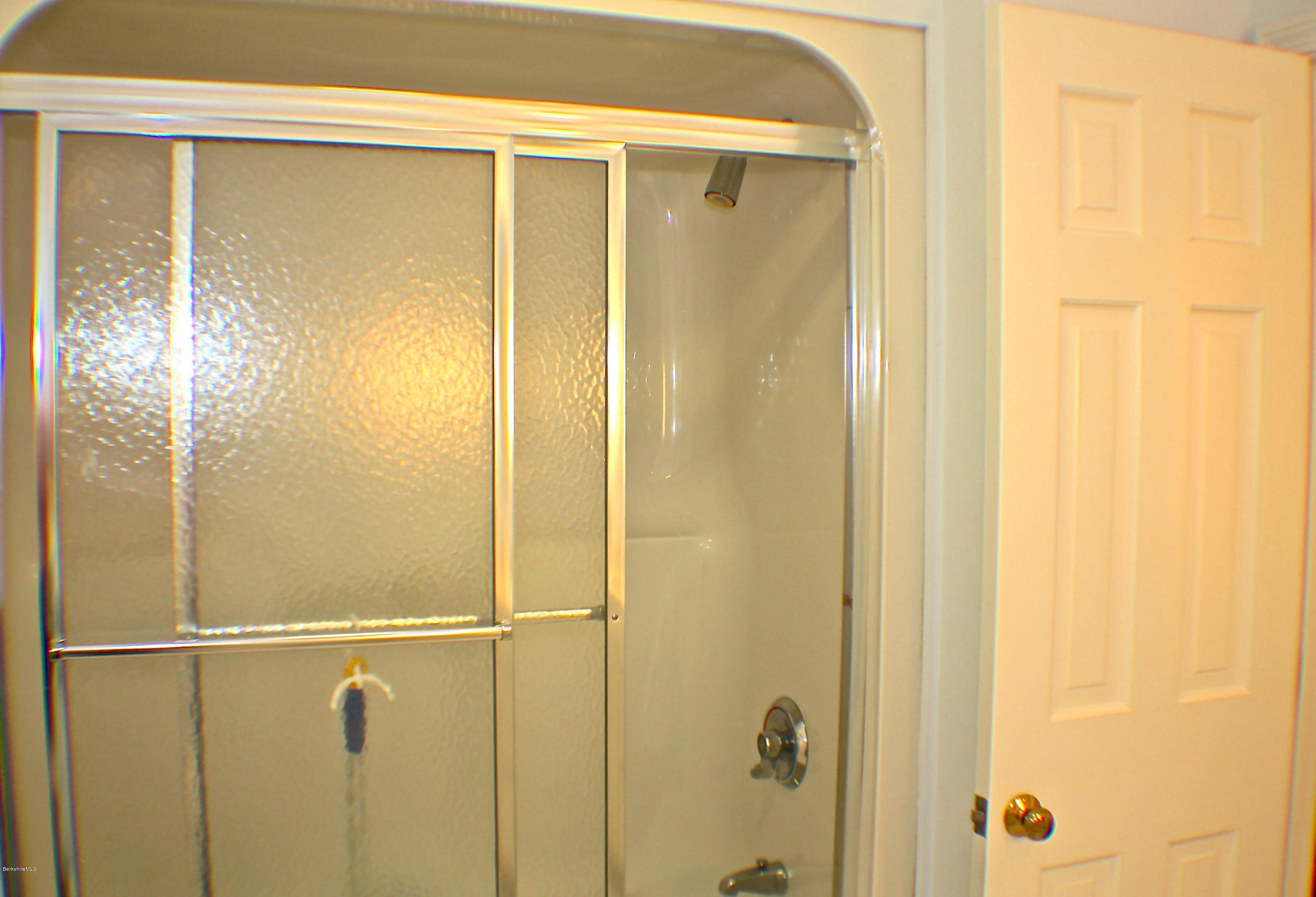 11 Quiet Knoll Road Stockbridge, MA 01266 - Photo 20 of 23 a bathroom with a glass shower door
