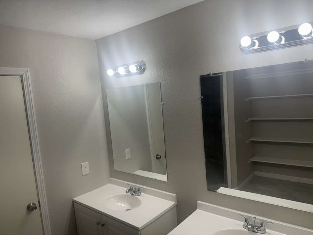 14911 Walters Road Houston, TX 77068 - Photo 11 of 13 a bathroom with a sink a toilet and shower