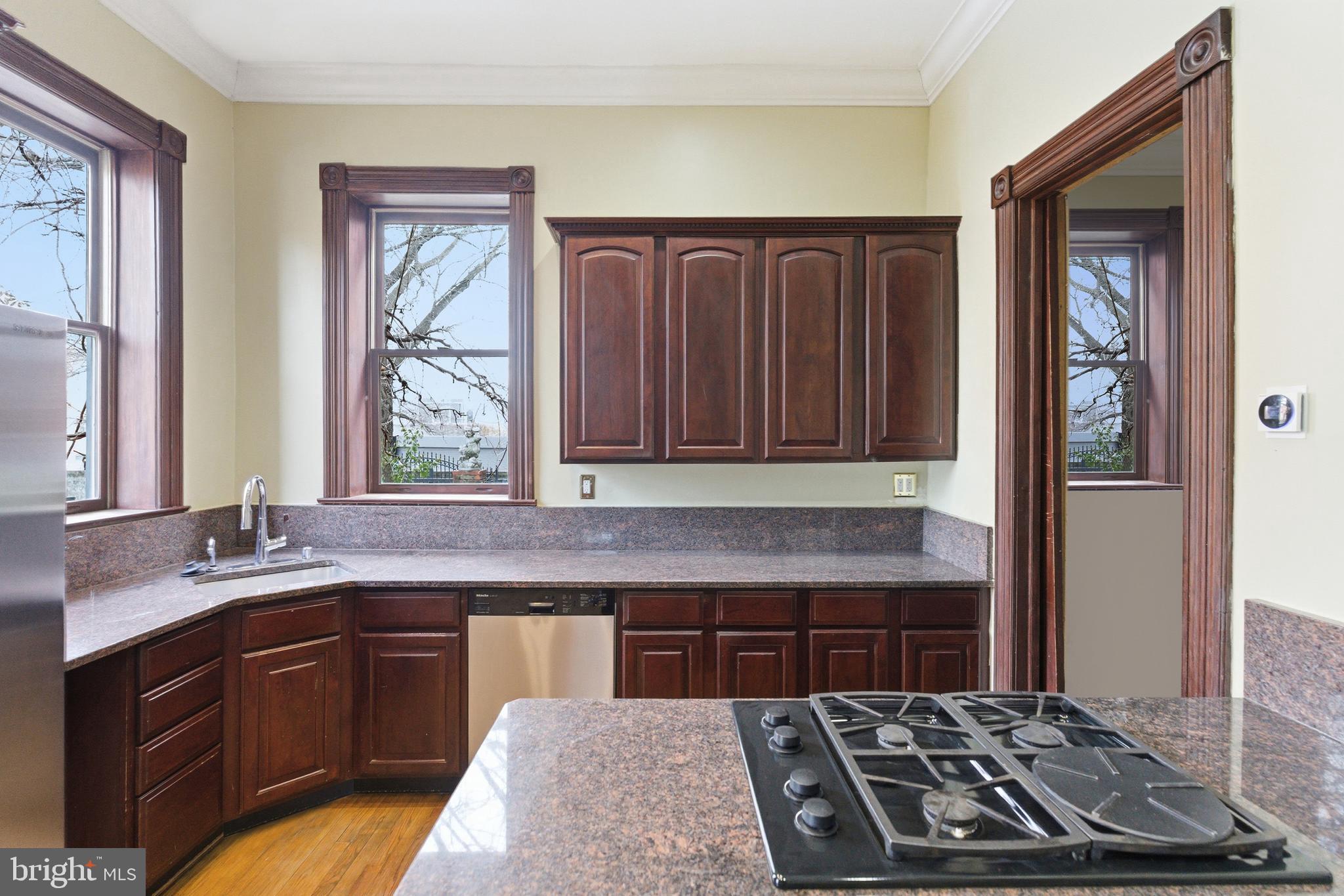 1827 13th Street Northwest Washington, DC 20009 - Photo 8 of 15 a kitchen with a stove and a sink