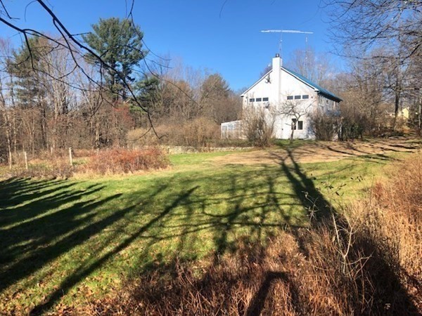 49 Cave Hill Road Leverett, MA 01054 - Photo 36 of 42 a view of a house with a yard