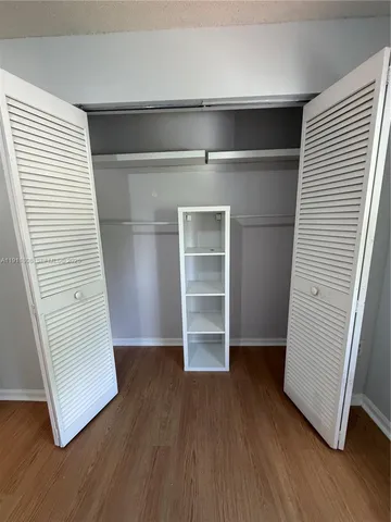 a spacious bathroom with a double vanity sink mirror and shower