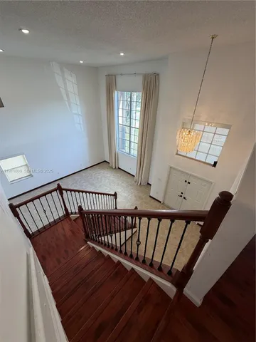a view of a balcony with wooden floor