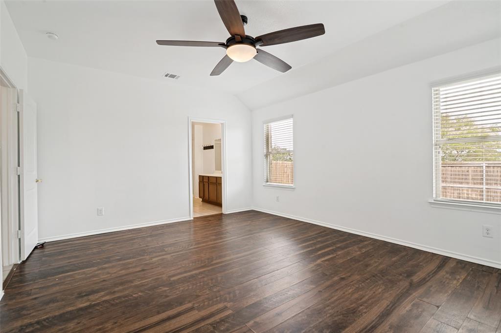 3415 Emerson Road Forney, TX 75126 - Photo 18 of 26 an empty room with wooden floor fan and windows