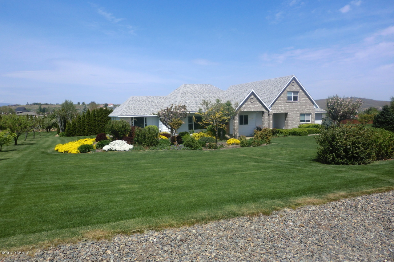 12113 West Barrett Road Yakima, WA 98908 - Photo 2 of 36 a view of a house with a big yard and a large pool