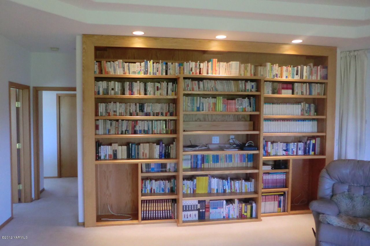 12113 West Barrett Road Yakima, WA 98908 - Photo 11 of 36 a view of a book shelf with lots of books