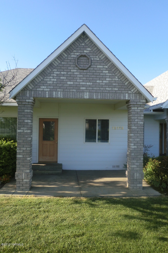 12113 West Barrett Road Yakima, WA 98908 - Photo 14 of 36 a front view of a house with a yard