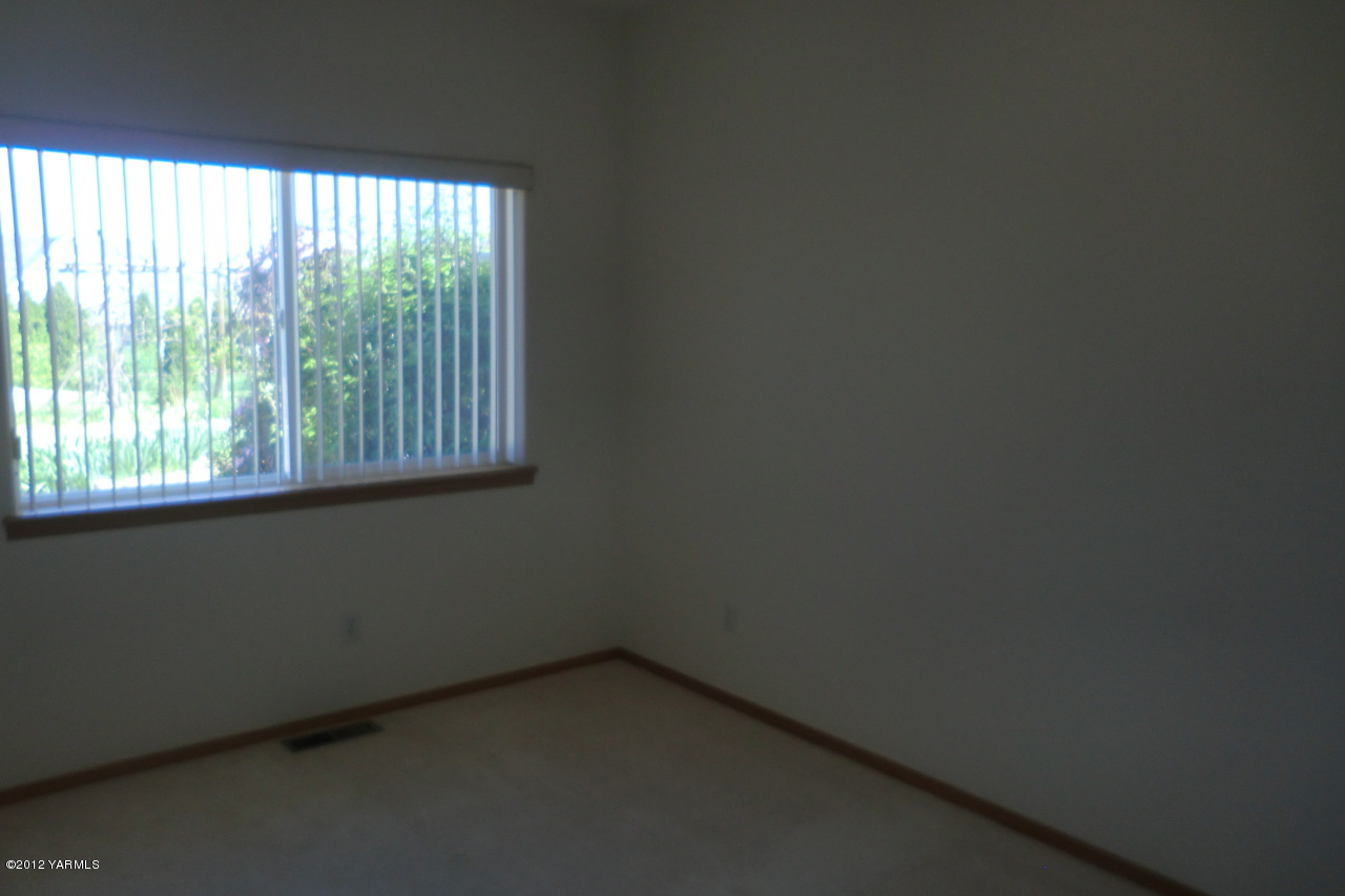 12113 West Barrett Road Yakima, WA 98908 - Photo 22 of 36 a view of an empty room with a window