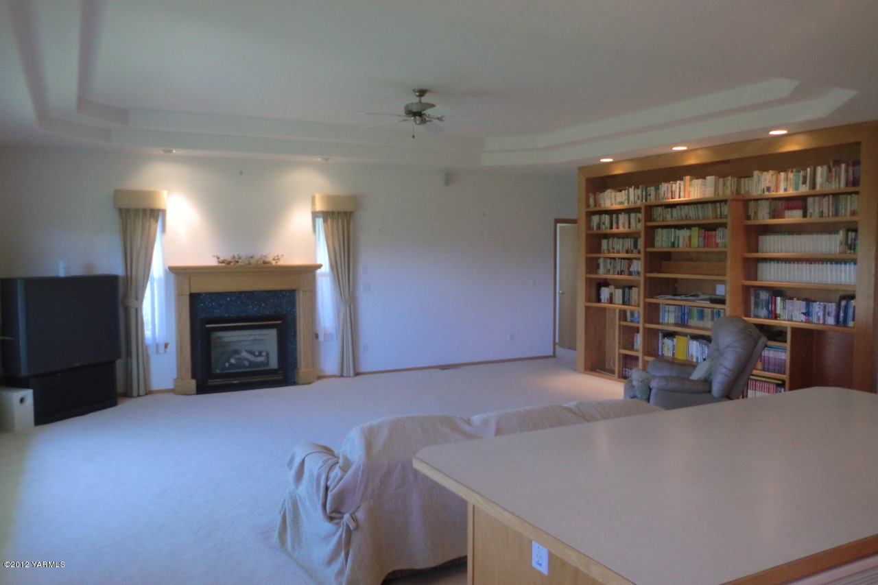 12113 West Barrett Road Yakima, WA 98908 - Photo 9 of 36 a view of a livingroom with furniture and staircase