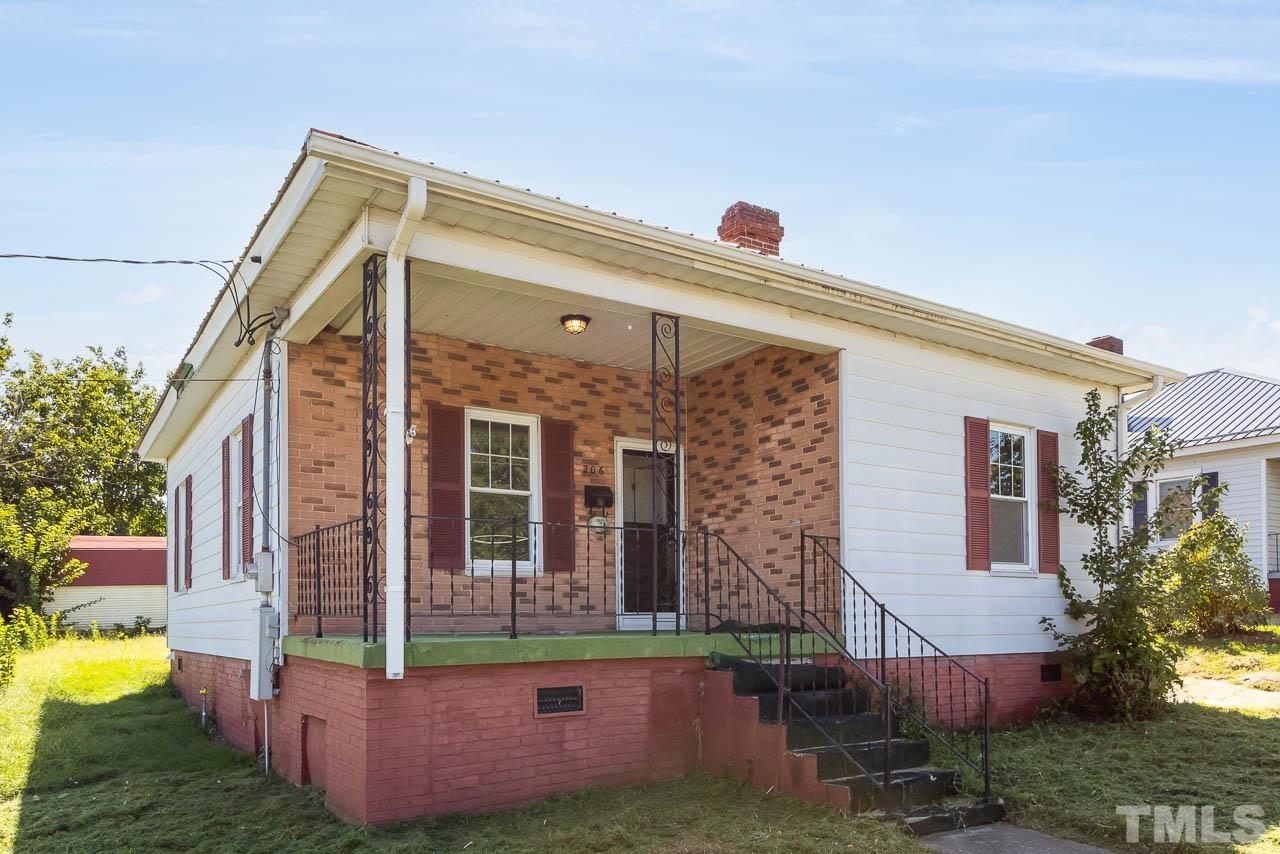 206 Edgar Street Roxboro, NC 27573 - Photo 1 of 18 front view of house with a yard
