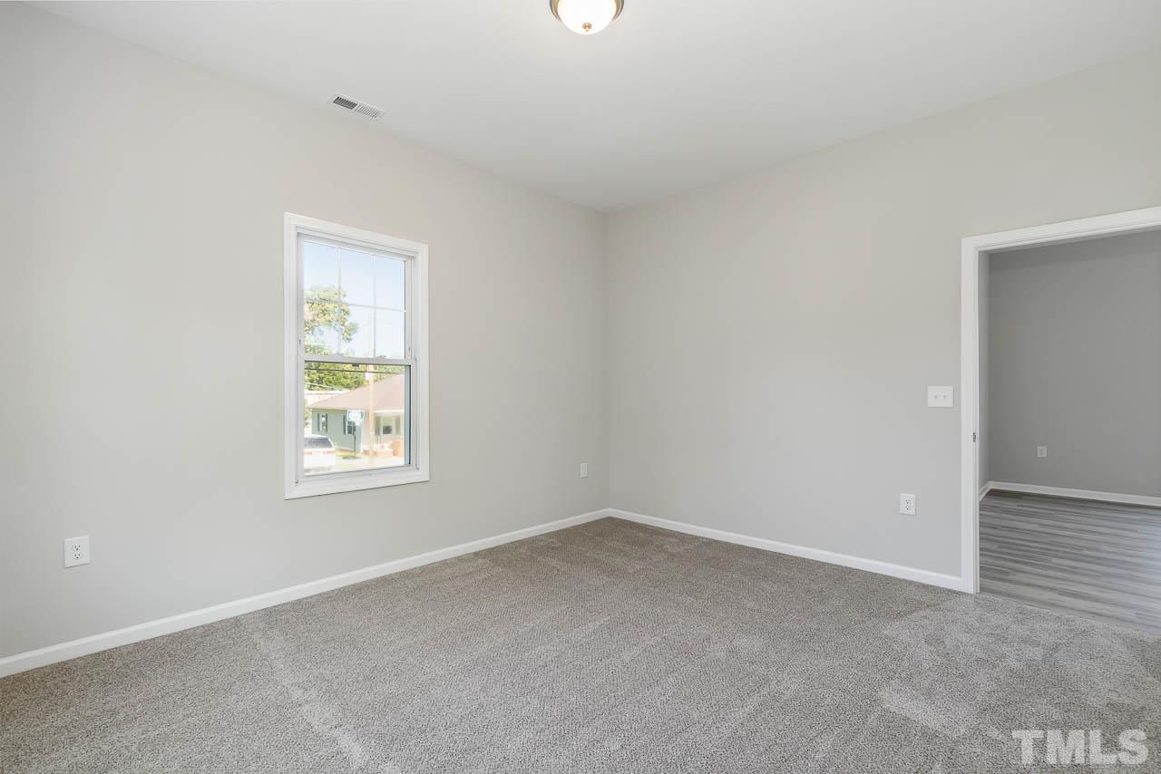 206 Edgar Street Roxboro, NC 27573 - Photo 11 of 18 an empty room with a window