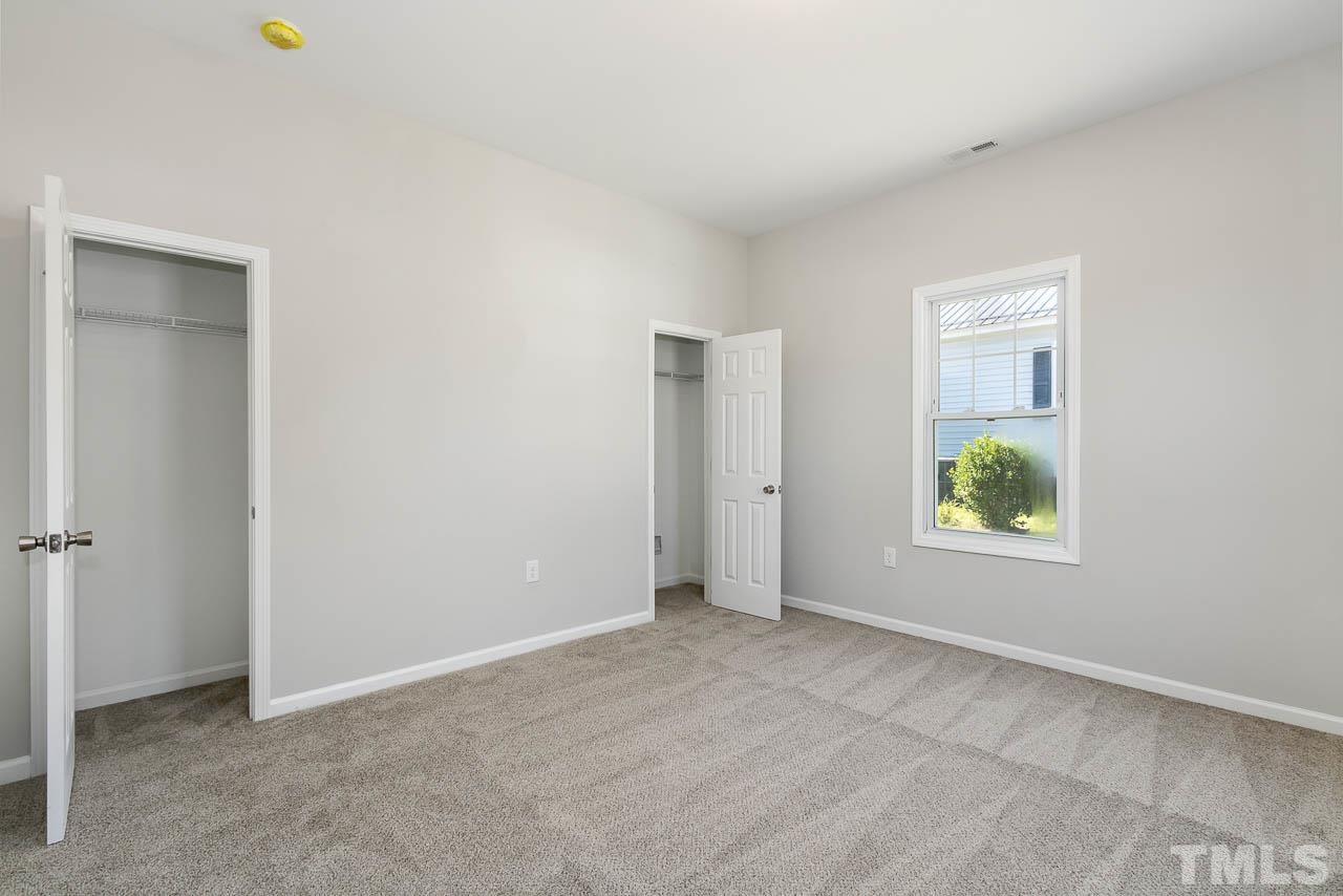 206 Edgar Street Roxboro, NC 27573 - Photo 13 of 18 an empty room with windows and closet