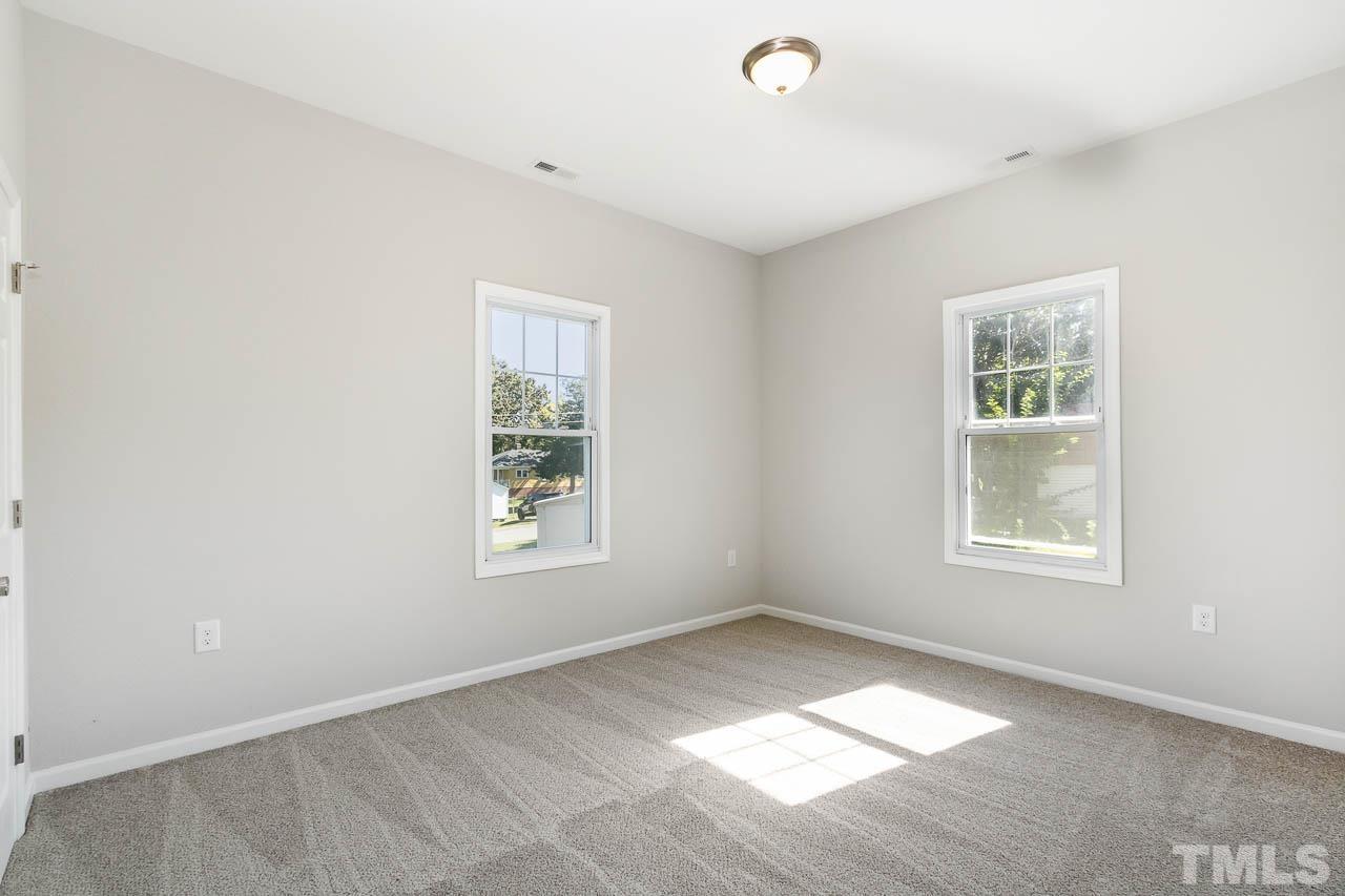 206 Edgar Street Roxboro, NC 27573 - Photo 14 of 18 a view of an empty room with a window