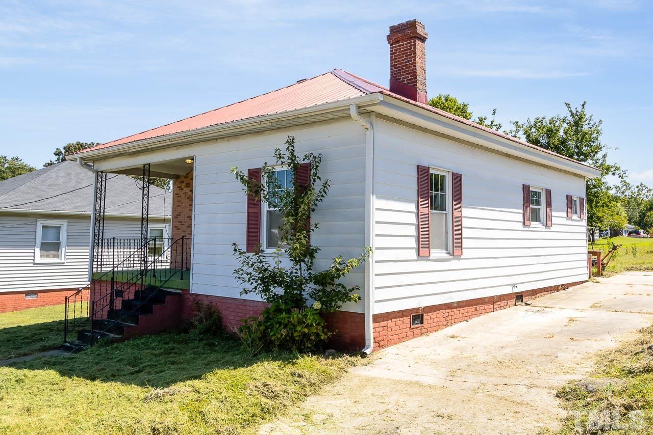 206 Edgar Street Roxboro, NC 27573 - Photo 2 of 18 a front view of a house with garden