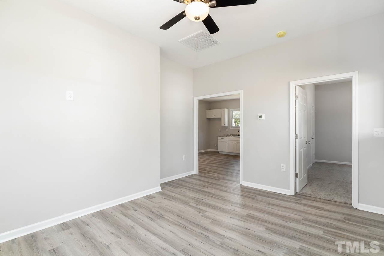 206 Edgar Street Roxboro, NC 27573 - Photo 5 of 18 a view of empty room with wooden floor
