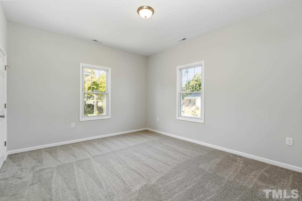 206 Edgar Street Roxboro, NC 27573 - Photo 10 of 18 an empty room with windows