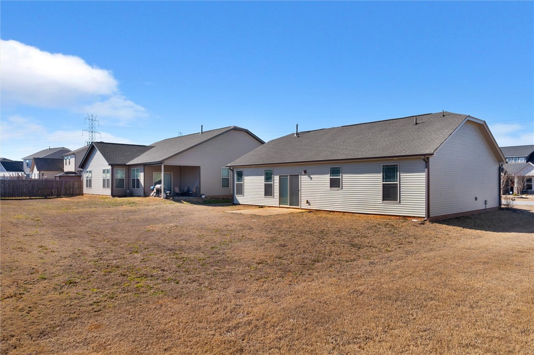 155 Norfolk Circle Anderson, SC 29625 - Photo 26 of 33 This spacious backyard offers ample room for outdoor activities and future landscaping.