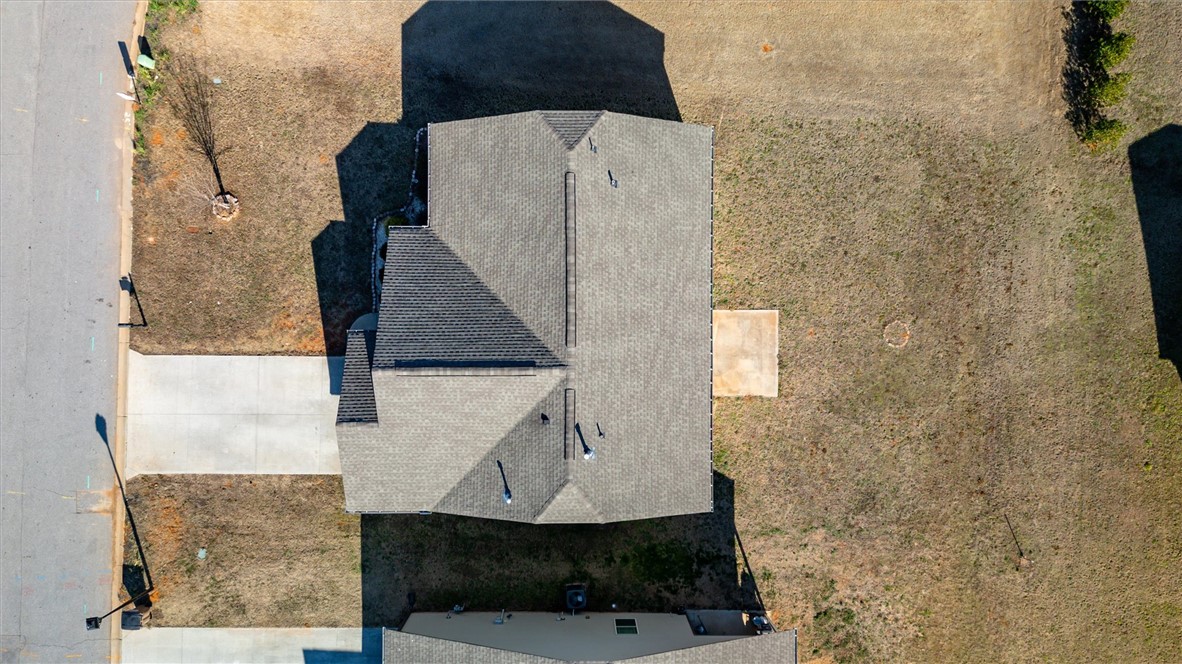 155 Norfolk Circle Anderson, SC 29625 - Photo 28 of 33 An aerial view showcases a residential property with a shingle roof and surrounding landscape.