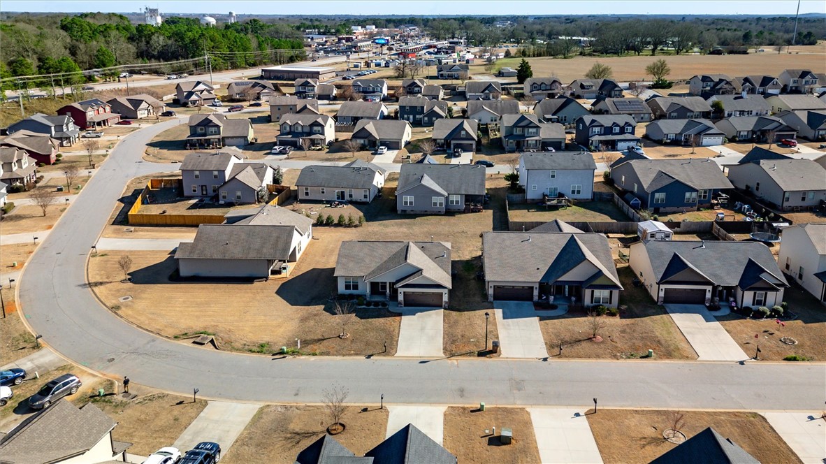 155 Norfolk Circle Anderson, SC 29625 - Photo 30 of 33 An aerial view of a quiet suburban neighborhood with detached homes along a curved street.