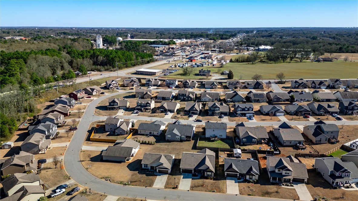 155 Norfolk Circle Anderson, SC 29625 - Photo 31 of 33 An aerial view captures a quiet suburban neighborhood with uniform homes and streets.
