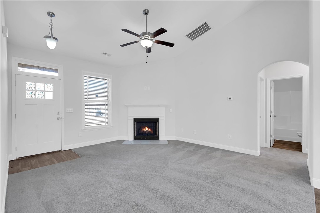 155 Norfolk Circle Anderson, SC 29625 - Photo 4 of 33 Bright and inviting living space with a cozy fireplace and vaulted ceilings.