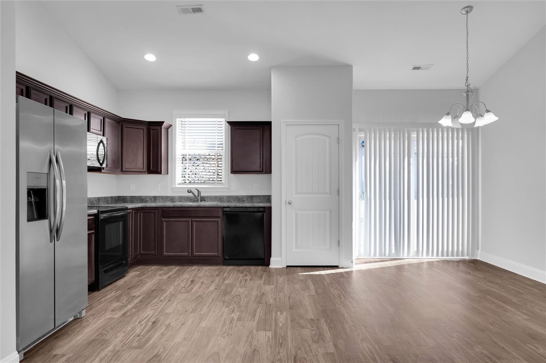 155 Norfolk Circle Anderson, SC 29625 - Photo 7 of 33 This inviting kitchen and dining area features abundant natural light and seamless flow.