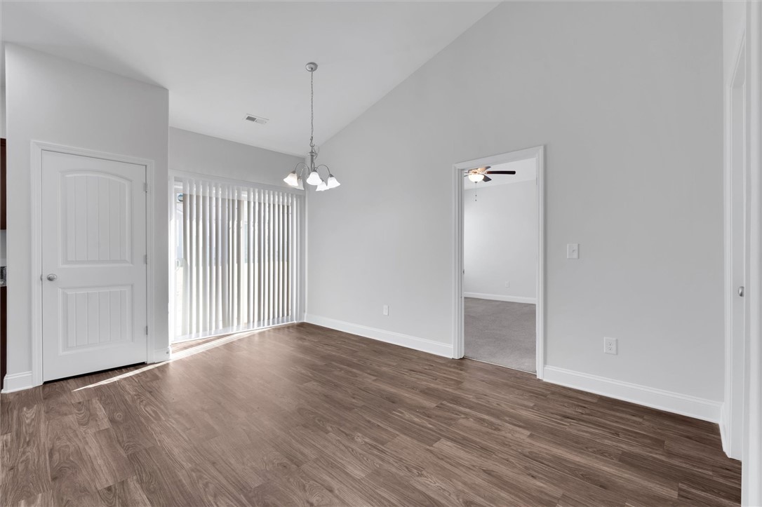 155 Norfolk Circle Anderson, SC 29625 - Photo 10 of 33 This bright interior space features wood flooring, vaulted ceilings, and ample natural light.
