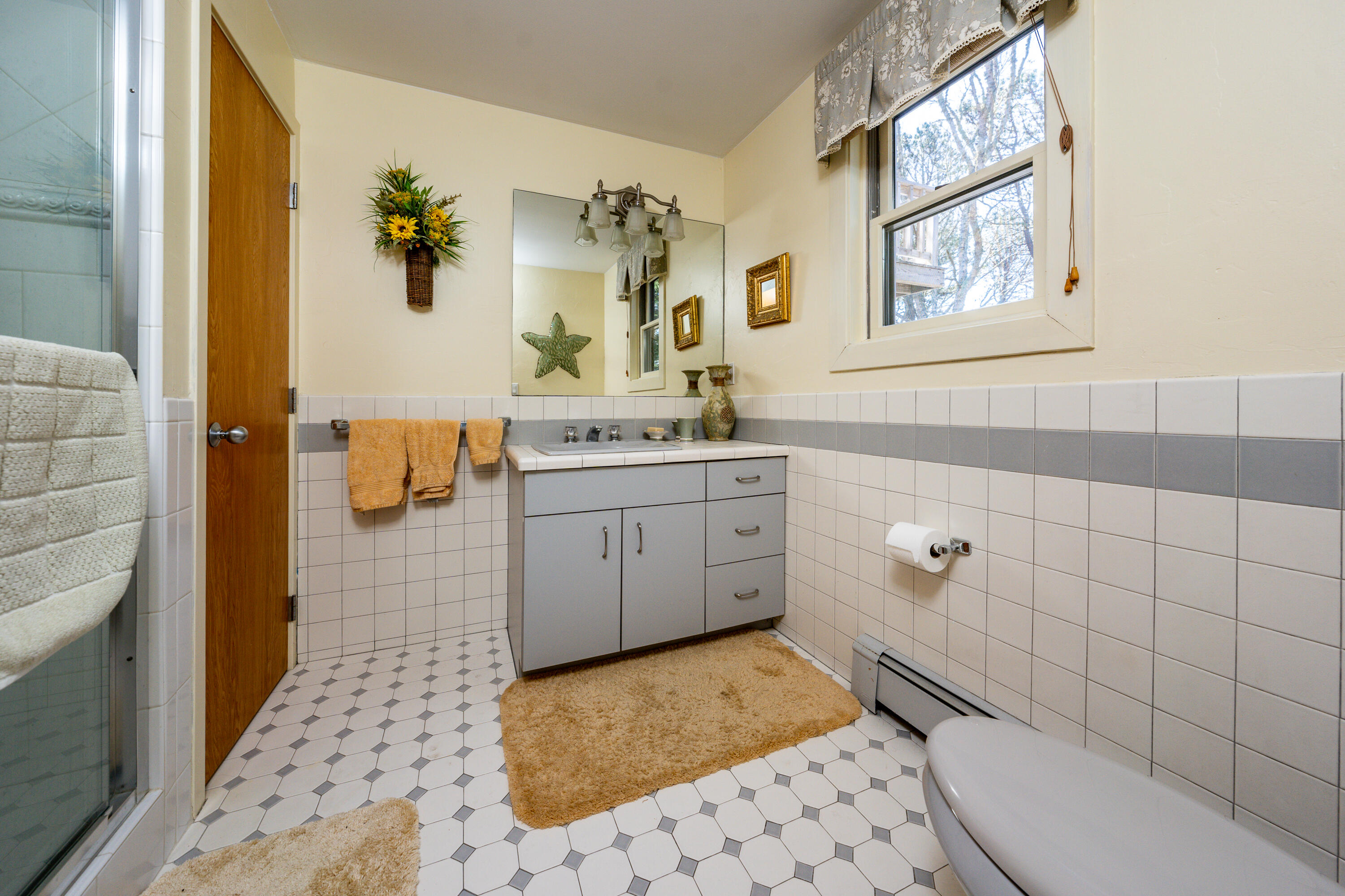 79 Waterside Drive Centerville, MA 02632 - Photo 20 of 50 a bathroom with a sink toilet and shower