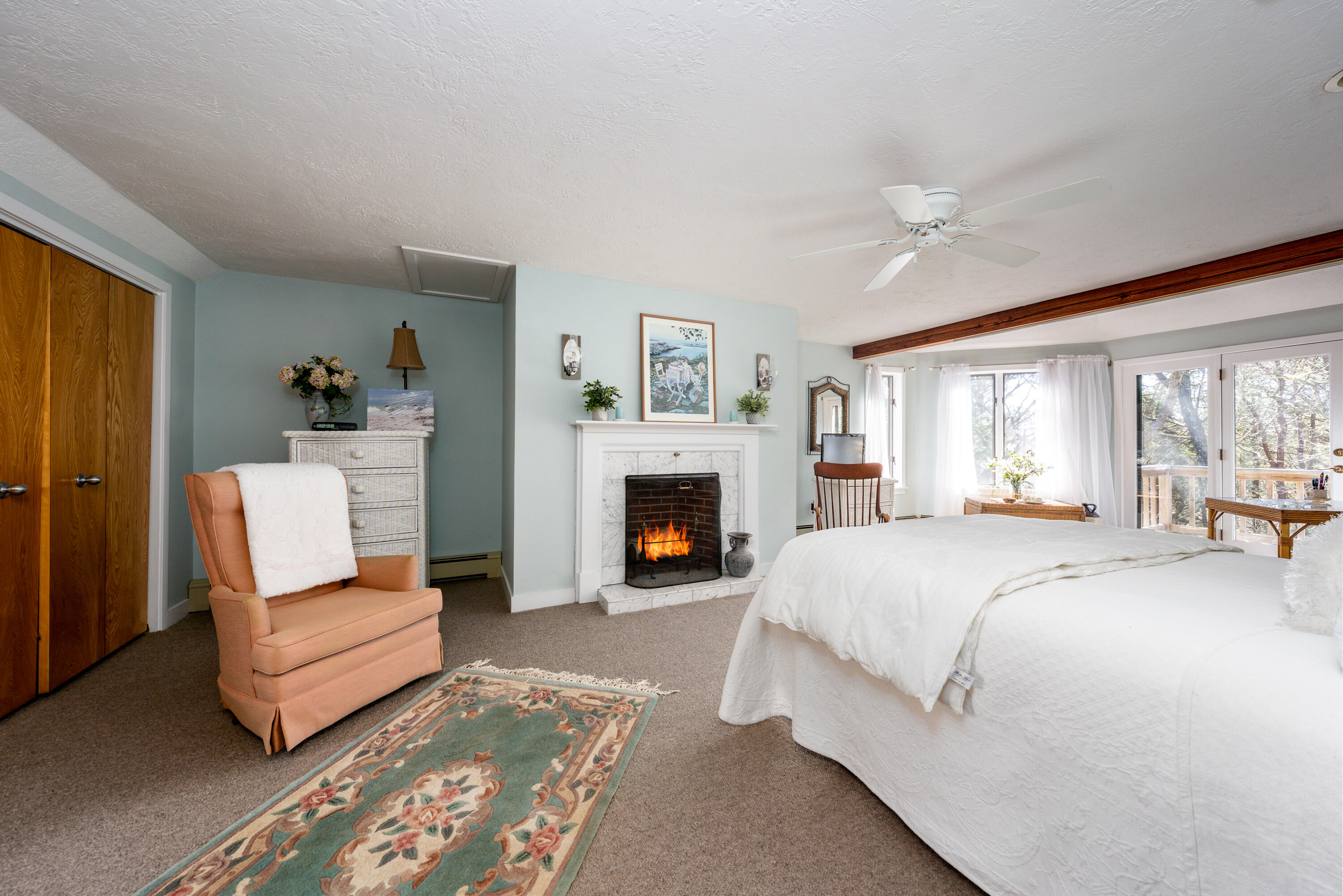 79 Waterside Drive Centerville, MA 02632 - Photo 22 of 50 a bed room with a bed and a fireplace