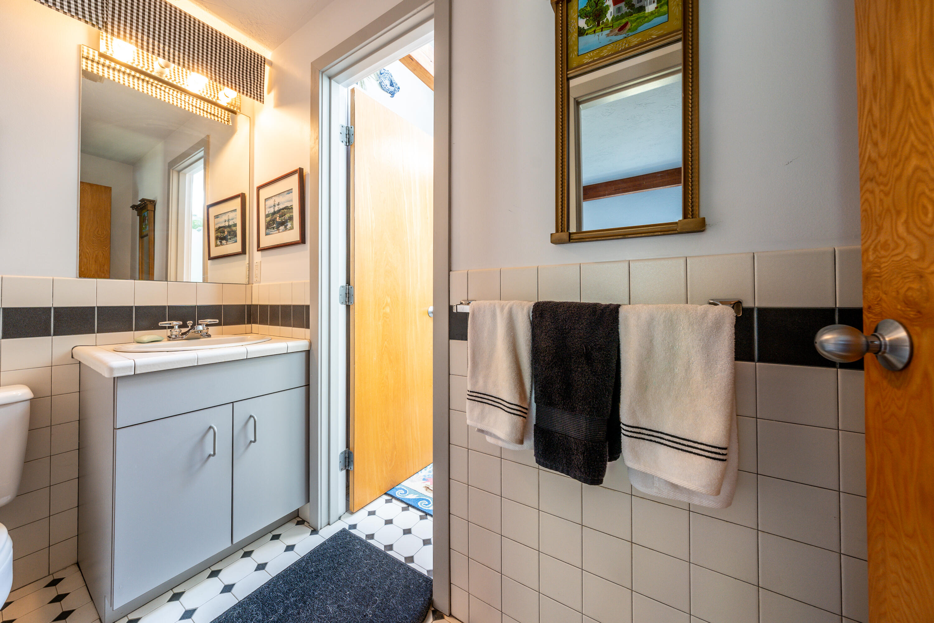 79 Waterside Drive Centerville, MA 02632 - Photo 29 of 50 a bathroom with a sink and a mirror