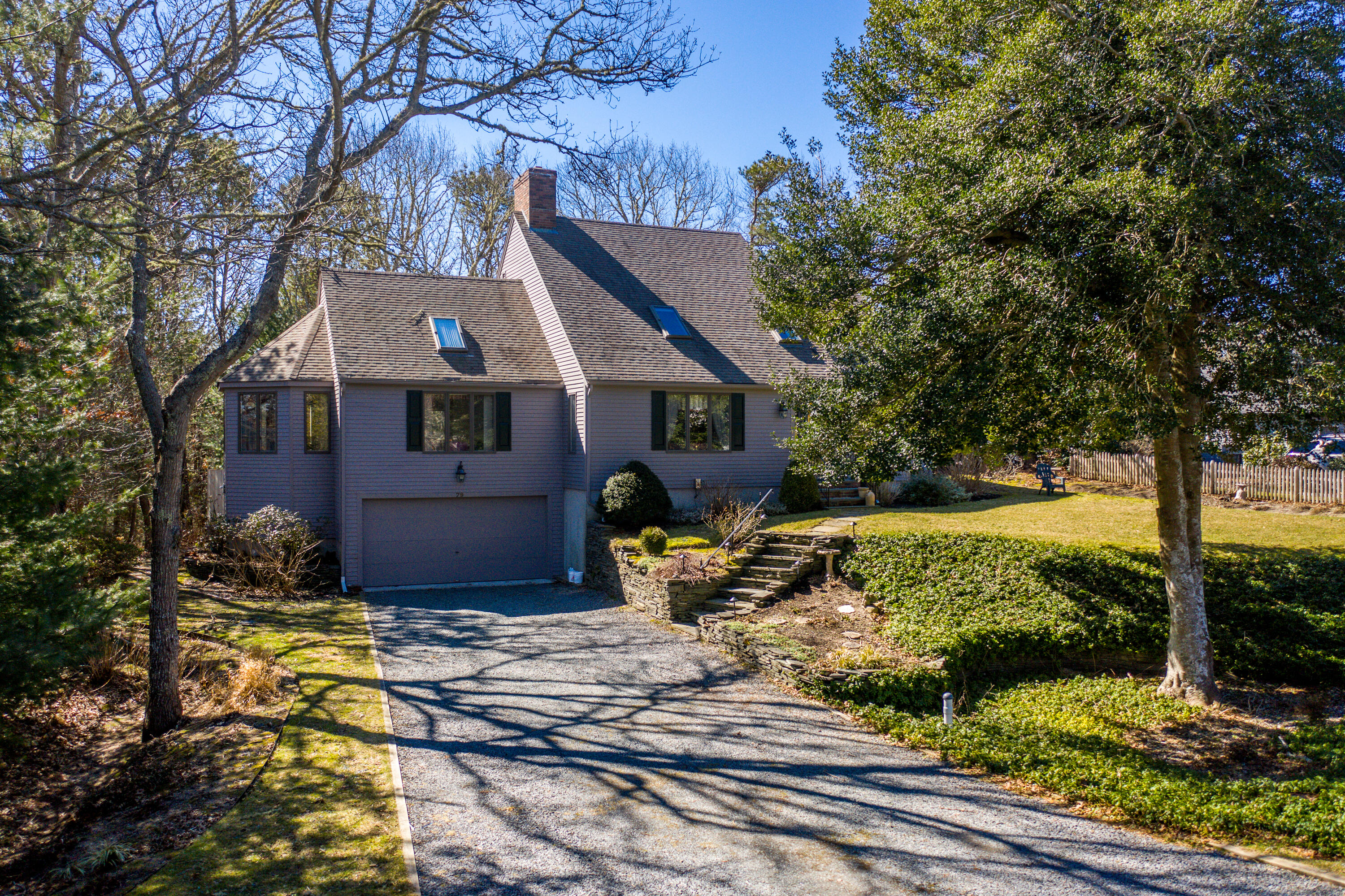 79 Waterside Drive Centerville, MA 02632 - Photo 45 of 50 a front view of a house with garden