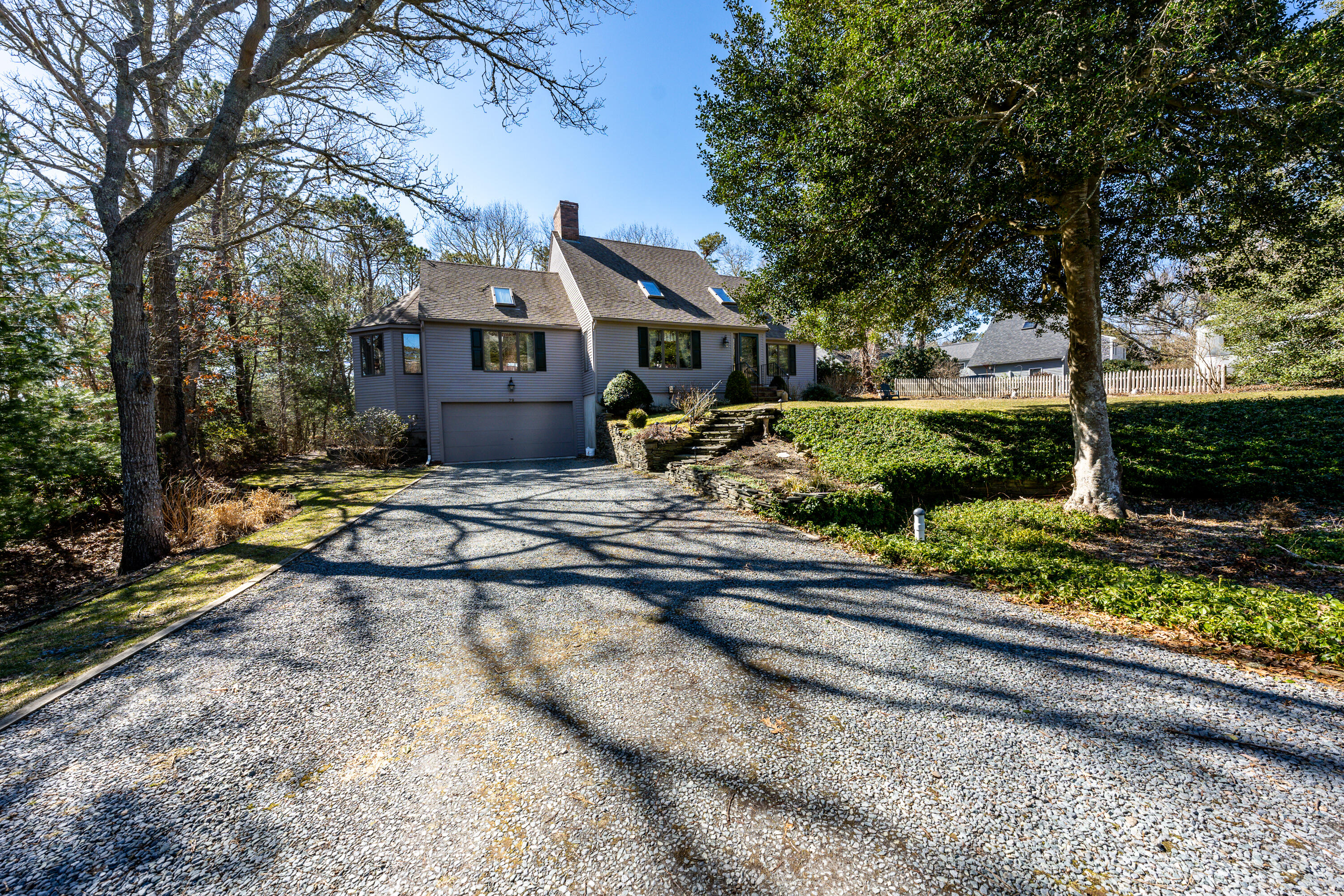 79 Waterside Drive Centerville, MA 02632 - Photo 47 of 50 a front view of a house with a garden