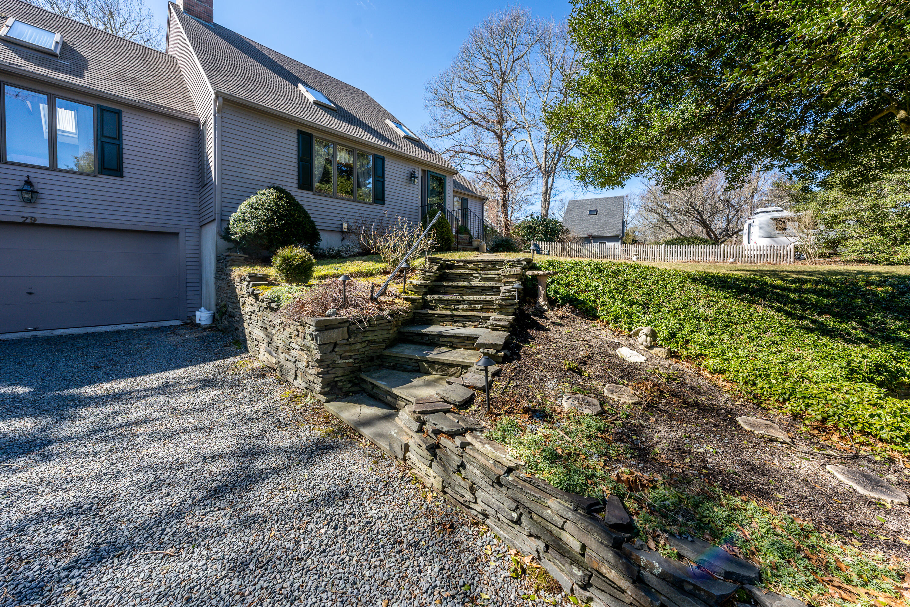 79 Waterside Drive Centerville, MA 02632 - Photo 48 of 50 a front view of a house with garden