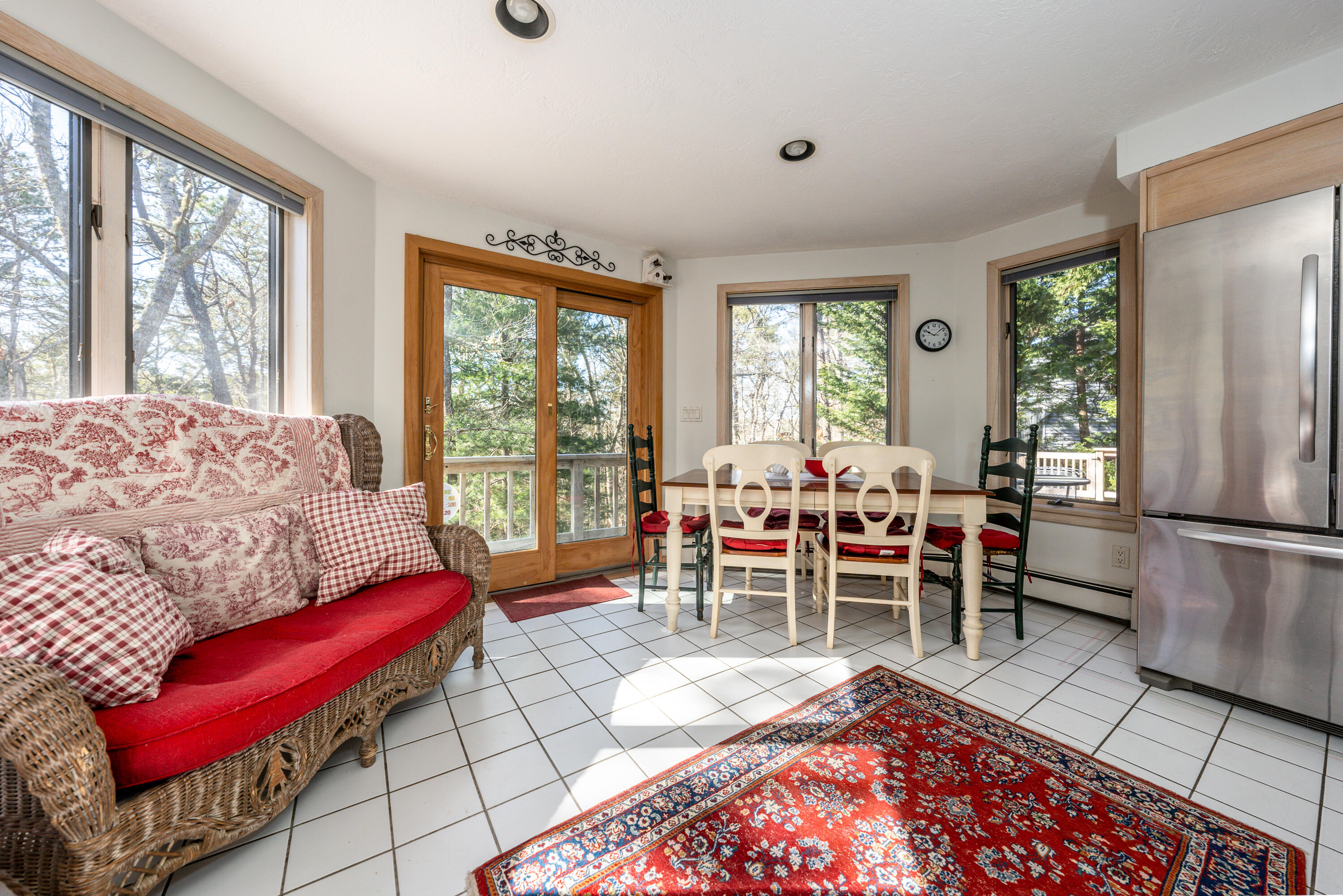 79 Waterside Drive Centerville, MA 02632 - Photo 10 of 50 a living room with furniture a large window and a table