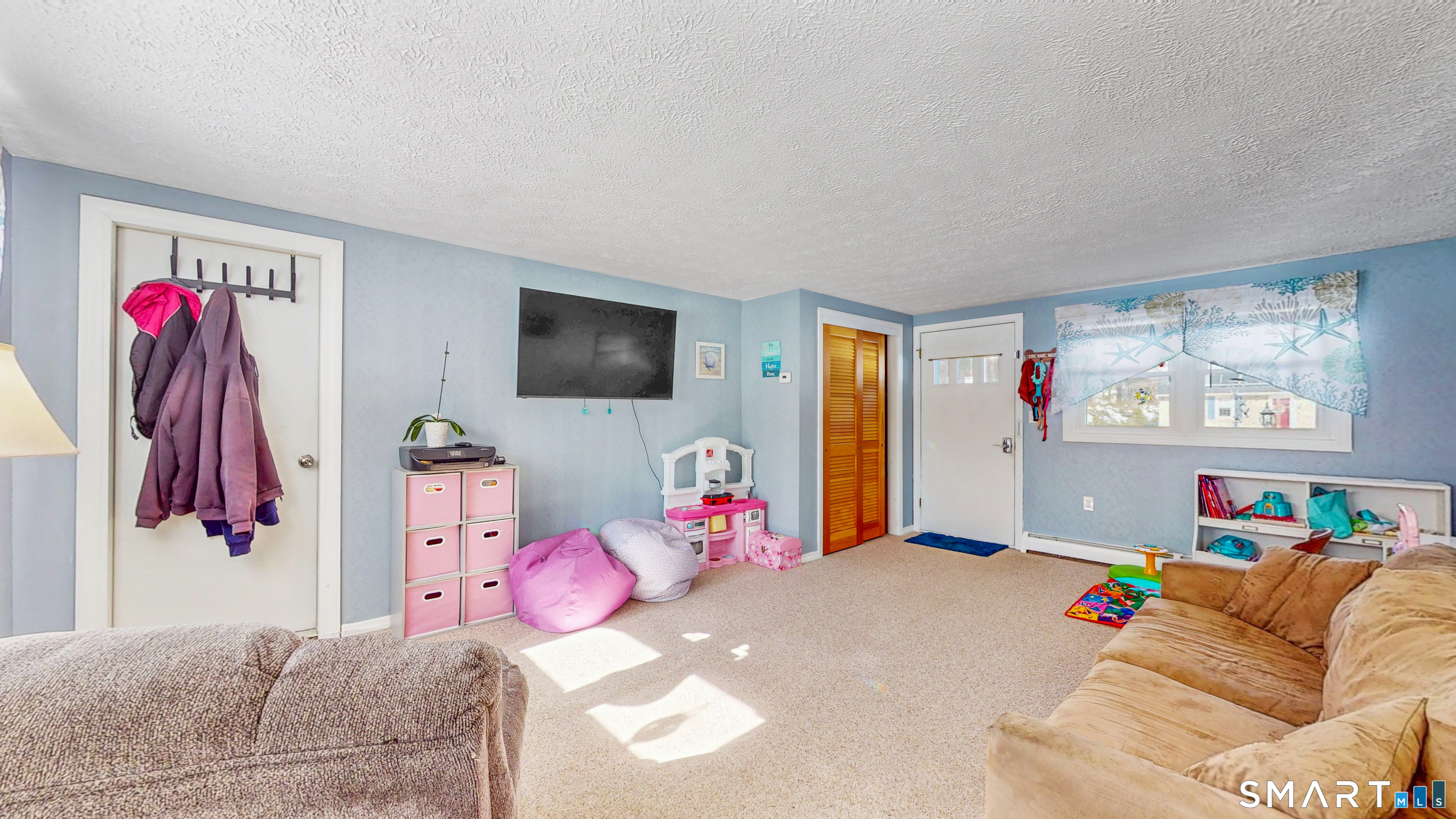 38 Eastgate Lane Enfield, CT 06082 - Photo 14 of 33 a bedroom with a bed and a flat screen tv