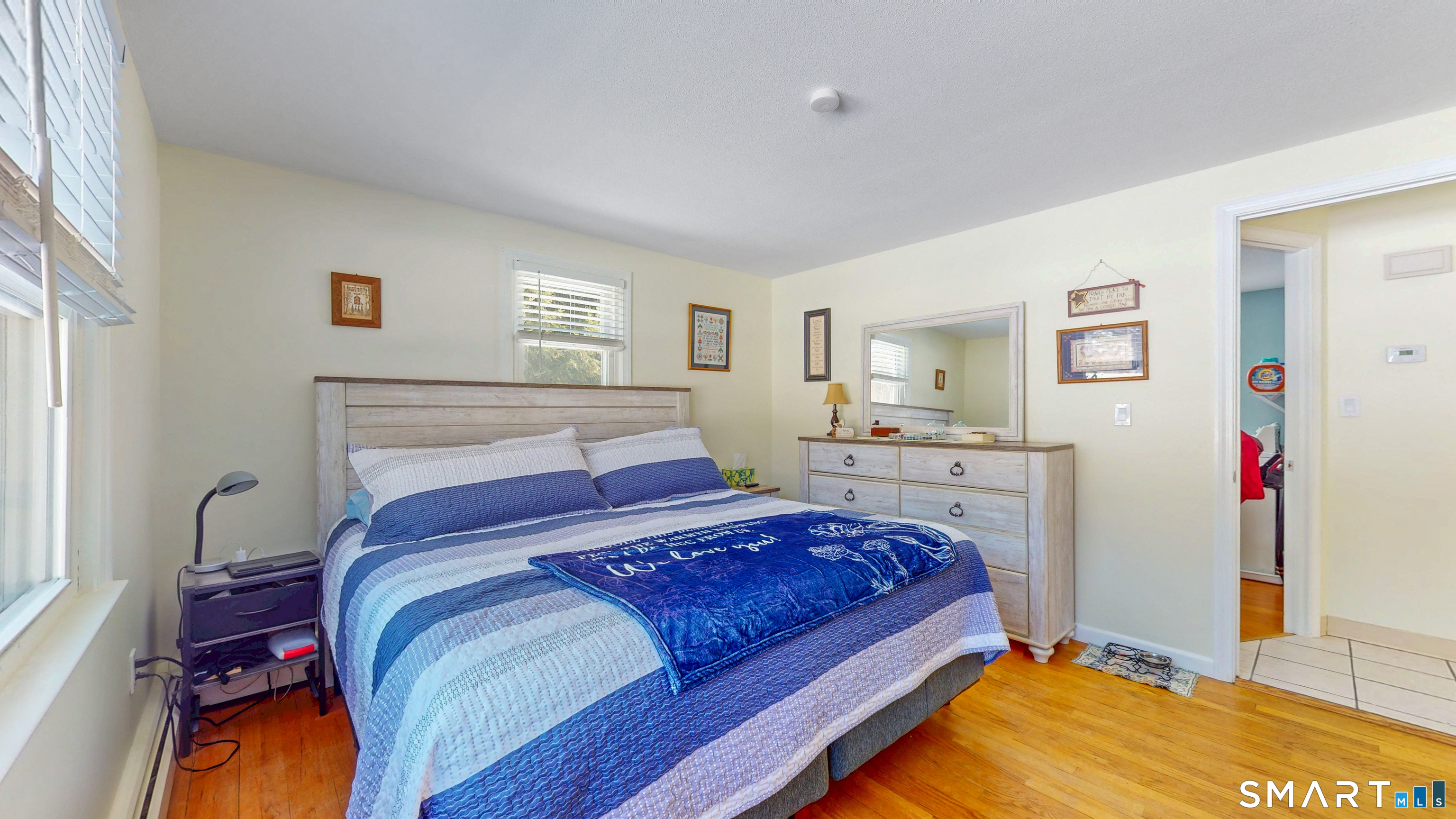 38 Eastgate Lane Enfield, CT 06082 - Photo 18 of 33 a bedroom with a bed and a lamp