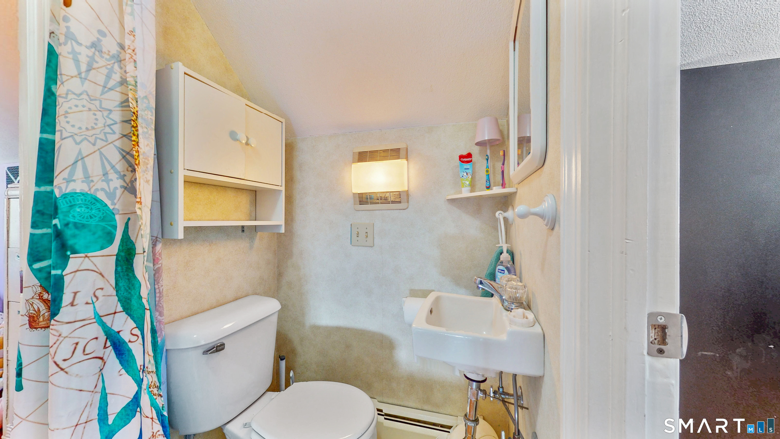 38 Eastgate Lane Enfield, CT 06082 - Photo 23 of 33 a bathroom with a sink mirror vanity and toilet
