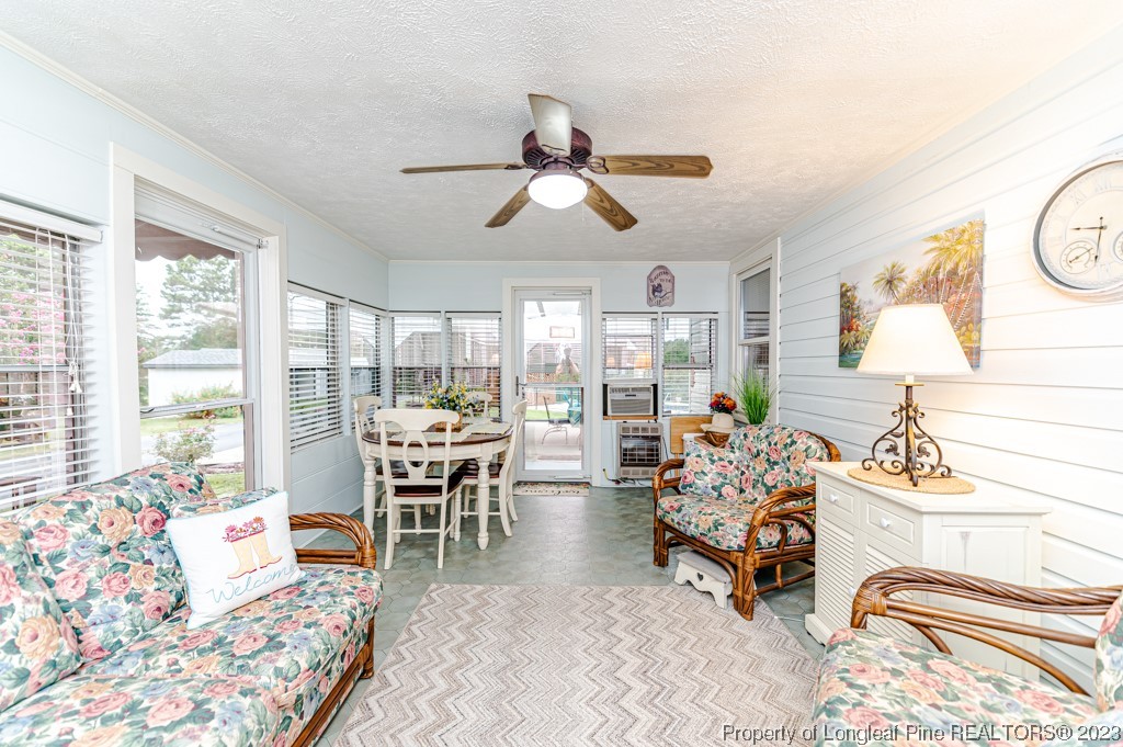 2411 Colon Road Sanford, NC 27330 - Photo 13 of 50 a living room with furniture and a large window